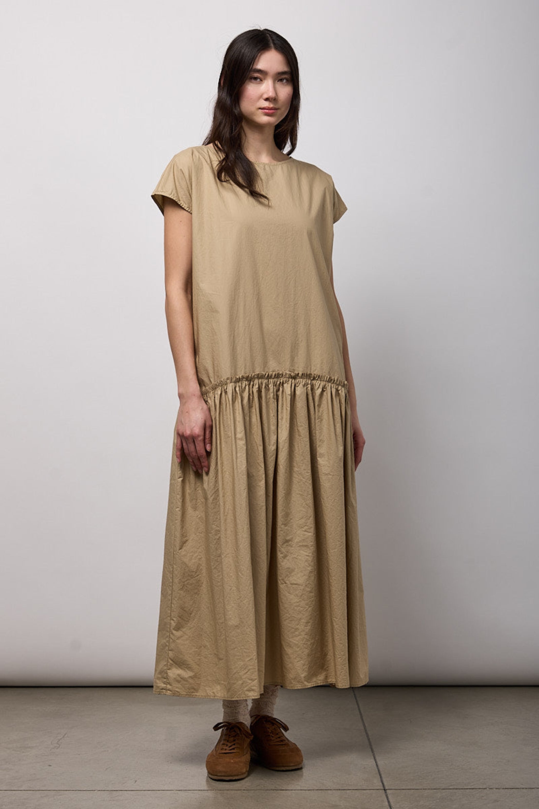 NEIRAMI Long Dropped Gathered Waist Dress in Sand