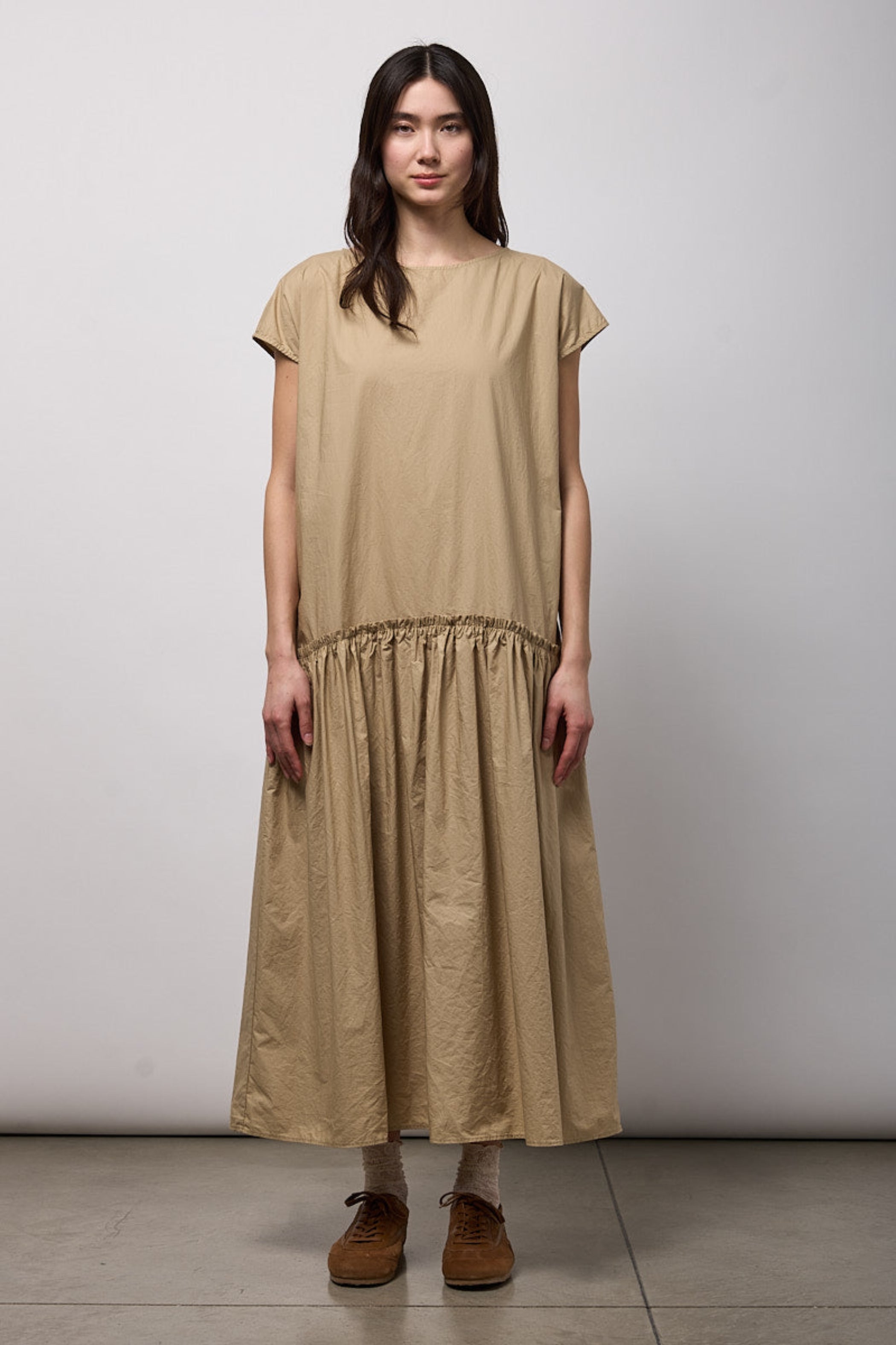 NEIRAMI Long Dropped Gathered Waist Dress in Sand