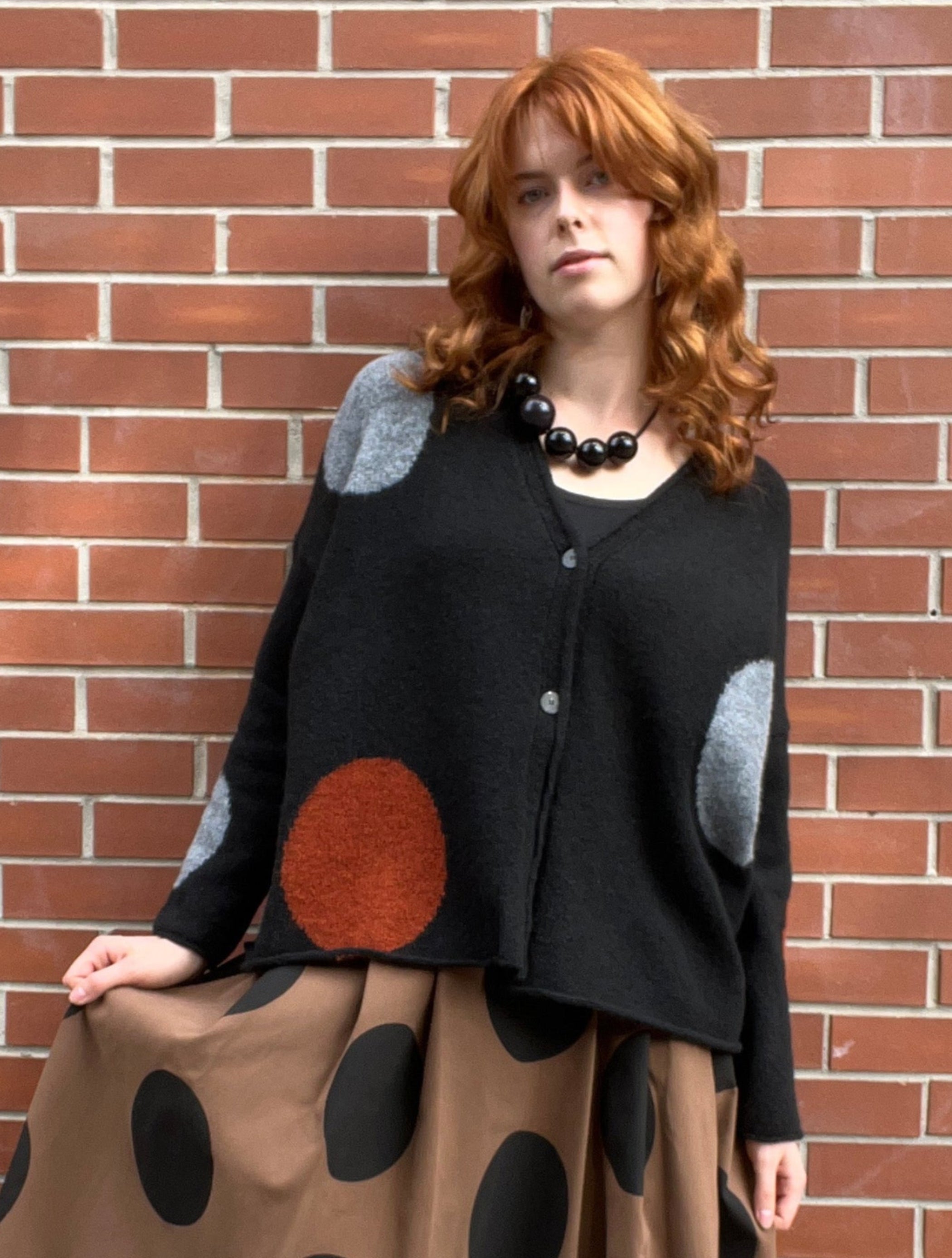 NEIRAMI Circle Print Two-Button Cardigan in Black