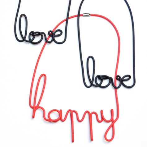 Rubber and wire “happy” and “love” collars.
